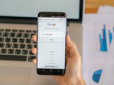Loei, Thailand - May 10, 2017: Hand holding samsung s8 with mobile application for Google on the screen